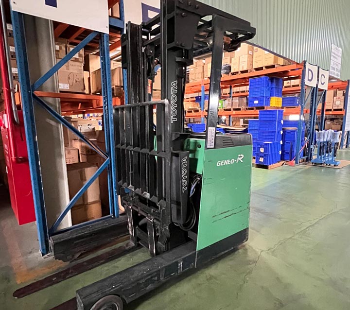 Warehouse interior view with forklift